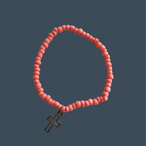 PINK BEADED ELASTIC BRACELET WITH CROSS CHARM